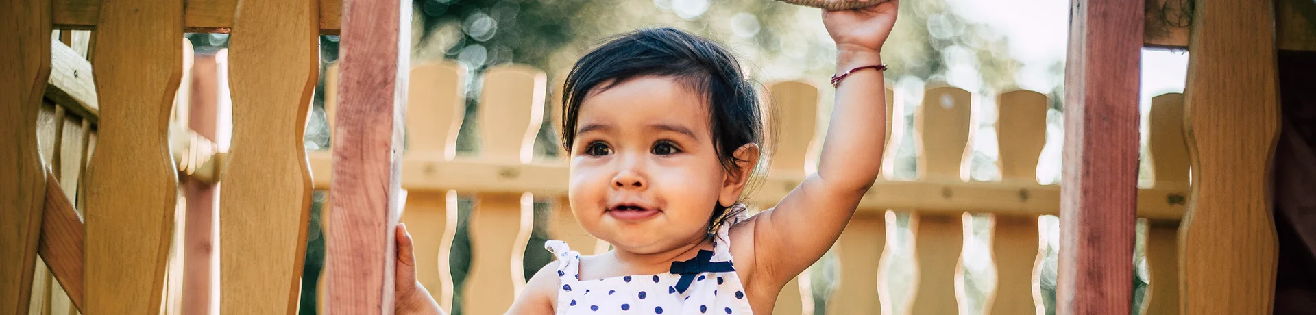 Infant Care Baby Steps pagetitle background - baby playing on safe playground equipment Baby Steps: Infant Daycare